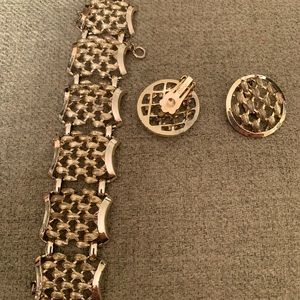 Gold bracelet and clip earrings